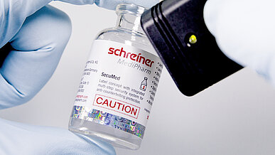 Labels on vials can be equipped with anti-counterfeiting features and these can be checked for authenticity using a reader.
